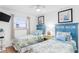 Bright bedroom with two beds, coastal decor, and natural light creating a comfortable and inviting space at 17500 Gulf Blvd # 407, Redington Shores, FL 33708