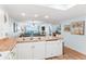 Bright open-concept kitchen leading to the living area with views of the ocean at 17500 Gulf Blvd # 407, Redington Shores, FL 33708