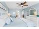 Comfortable bedroom with white furniture and coastal decor at 17500 Gulf Blvd # 407, Redington Shores, FL 33708