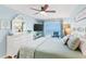 Comfortable bedroom with balcony access and views of the ocean at 17500 Gulf Blvd # 407, Redington Shores, FL 33708