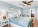 Comfortable bedroom with white furniture and coastal decor at 17500 Gulf Blvd # 407, Redington Shores, FL 33708
