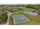 Community with basketball court, tennis court, soccer field and pond offering diverse recreational options at 18036 Java Isle Dr, Tampa, FL 33647
