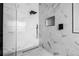 Modern shower features a glass enclosure and matte black fixtures at 18036 Java Isle Dr, Tampa, FL 33647