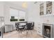 Cozy dining area features a banquette, modern lighting, and built-in bar with beverage cooler at 18036 Java Isle Dr, Tampa, FL 33647