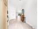 Bright entryway with light wood-look tile flooring and modern decor at 18036 Java Isle Dr, Tampa, FL 33647