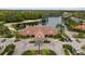 Expansive lakefront estate boasts lush landscaping, circular driveway, and serene water views at 18036 Java Isle Dr, Tampa, FL 33647