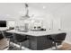Spacious kitchen featuring a center island with bar seating and modern appliances at 18036 Java Isle Dr, Tampa, FL 33647
