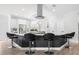 Stylish kitchen island with bar seating and modern pendant lighting at 18036 Java Isle Dr, Tampa, FL 33647