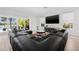 Relaxing living area with comfortable seating and scenic outdoor views at 18036 Java Isle Dr, Tampa, FL 33647