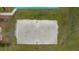 Aerial view of community sand volleyball court showing the net and surrounding green space at 18036 Java Isle Dr, Tampa, FL 33647