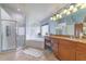 Bright bathroom with tiled floor, shower, jetted tub, vanity with granite counter at 18504 Country Crest Pl, Tampa, FL 33647