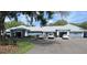 Exterior shot of community center with ample parking, landscaping, and welcoming entrance at 18504 Country Crest Pl, Tampa, FL 33647