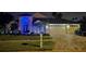 Charming two-story home with a three-car garage and beautifully landscaped yard with festive lighting at 18504 Country Crest Pl, Tampa, FL 33647