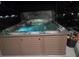 Inviting hot tub with crystal-clear water, ambient lighting, and a relaxing outdoor experience at 18504 Country Crest Pl, Tampa, FL 33647