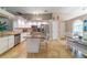 Open concept kitchen featuring granite countertops, stainless steel appliances, and white cabinetry at 18504 Country Crest Pl, Tampa, FL 33647
