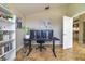 Functional office space featuring tile floors, neutral walls, and a dual-monitor desk setup at 18504 Country Crest Pl, Tampa, FL 33647