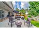 Spacious outdoor patio featuring comfortable seating, a dining set, and a well-manicured lawn at 18504 Country Crest Pl, Tampa, FL 33647