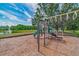 Community playground featuring play structure with slides and climbing elements at 18504 Country Crest Pl, Tampa, FL 33647