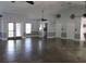 Spacious recreation room with high ceilings, ceiling fans, natural light, and neutral tones at 18504 Country Crest Pl, Tampa, FL 33647