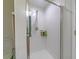 This shower features subway tile surround, chrome shower head, and a built-in soap rack at 18504 Country Crest Pl, Tampa, FL 33647