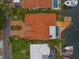 Aerial view of a canal-front home highlighting the pool, dock, and meticulously landscaped grounds at 1931 Kentucky Ne Ave, St Petersburg, FL 33703