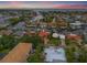 Panoramic aerial of a beautiful waterfront neighborhood, featuring canal-front homes and boat access at 1931 Kentucky Ne Ave, St Petersburg, FL 33703
