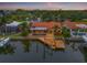Waterfront home boasts a private dock, pool, and picturesque canal views near a city skyline at 1931 Kentucky Ne Ave, St Petersburg, FL 33703