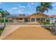 Waterfront home with canal access, featuring a dock and outdoor living space with bar at 1931 Kentucky Ne Ave, St Petersburg, FL 33703
