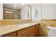 Vanity with granite countertop, decorative tile backsplash, and tile flooring at 1931 Kentucky Ne Ave, St Petersburg, FL 33703