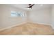 Bright bedroom featuring tile flooring, a ceiling fan, neutral paint, and natural light at 1931 Kentucky Ne Ave, St Petersburg, FL 33703