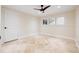 Well-lit bedroom featuring tile flooring, ceiling fan, and neutral paint at 1931 Kentucky Ne Ave, St Petersburg, FL 33703