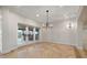 Bright dining room featuring stone floors, modern lighting, and outdoor access at 1931 Kentucky Ne Ave, St Petersburg, FL 33703