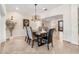 Dining room with contemporary chandelier and views into the living room at 1931 Kentucky Ne Ave, St Petersburg, FL 33703