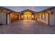 Grand home exterior with a circular brick driveway and a covered entryway with elegant columns and a two-car garage at 1931 Kentucky Ne Ave, St Petersburg, FL 33703