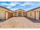 Elegant home exterior featuring a paver driveway, arched entryway, and detailed trim at 1931 Kentucky Ne Ave, St Petersburg, FL 33703