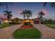 Beautiful home with well-maintained landscaping, a circular driveway, and a two-car garage, showing a luxurious curb appeal at 1931 Kentucky Ne Ave, St Petersburg, FL 33703