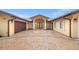 Elegant home with a brick driveway, arched entryway, and attached garage at 1931 Kentucky Ne Ave, St Petersburg, FL 33703