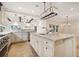 Kitchen area with bar, granite counters, stainless appliances and views to the water at 1931 Kentucky Ne Ave, St Petersburg, FL 33703