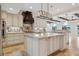 Spacious kitchen with a large center island, granite countertops, mosaic backsplash, and stainless steel appliances at 1931 Kentucky Ne Ave, St Petersburg, FL 33703