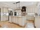 Bright kitchen featuring stainless appliances, granite counters, large island, and custom cabinetry at 1931 Kentucky Ne Ave, St Petersburg, FL 33703