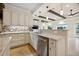 Kitchen area with bar, granite counters, stainless appliances and views to the water at 1931 Kentucky Ne Ave, St Petersburg, FL 33703