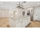 Kitchen island with granite counters, seating, and views to a dining and living area at 1931 Kentucky Ne Ave, St Petersburg, FL 33703