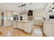 Bright kitchen featuring stainless appliances, granite counters, large island, and custom cabinetry at 1931 Kentucky Ne Ave, St Petersburg, FL 33703