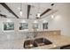 Kitchen area with bar, granite counters, stainless sink and views to the water at 1931 Kentucky Ne Ave, St Petersburg, FL 33703