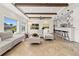 Bright living room featuring exposed beam ceilings, waterfront views, and stylish decor at 1931 Kentucky Ne Ave, St Petersburg, FL 33703