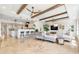 Open concept living and kitchen area featuring beam ceilings, stylish decor and natural light at 1931 Kentucky Ne Ave, St Petersburg, FL 33703