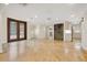Open-concept living room featuring tile floors, recessed lighting, and a decorative wine storage unit, perfect for entertaining at 1931 Kentucky Ne Ave, St Petersburg, FL 33703