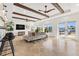 Bright living room featuring exposed beam ceilings, waterfront views, and light, airy decor at 1931 Kentucky Ne Ave, St Petersburg, FL 33703