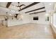 Spacious living room open to kitchen, featuring beamed ceilings and lots of natural light at 1931 Kentucky Ne Ave, St Petersburg, FL 33703