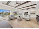 Bright living room featuring exposed beam ceilings, waterfront views, and light, airy decor at 1931 Kentucky Ne Ave, St Petersburg, FL 33703
